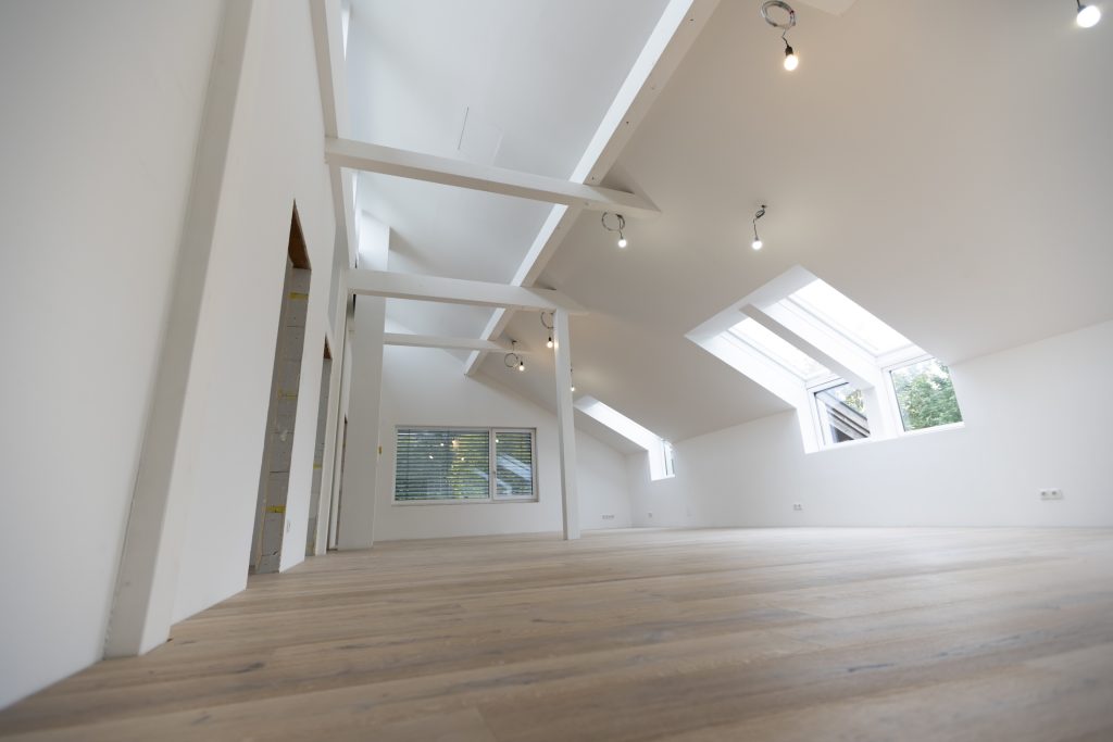 bright, new loft apartment with new parquet floor, without baseboards, skirting boards